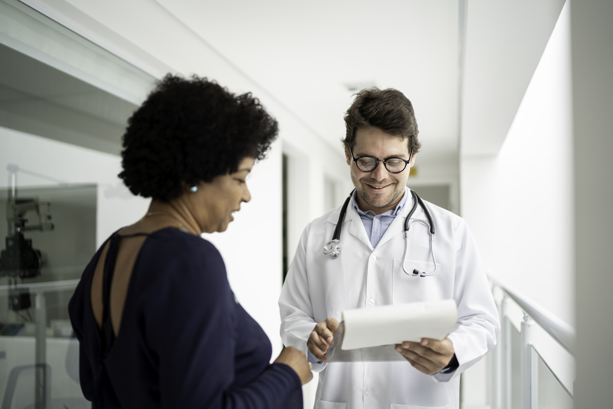 A woman consults her healthcare provider about participating in a clinical trial