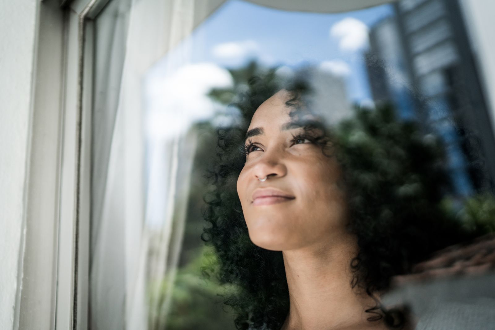 Woman looking out window