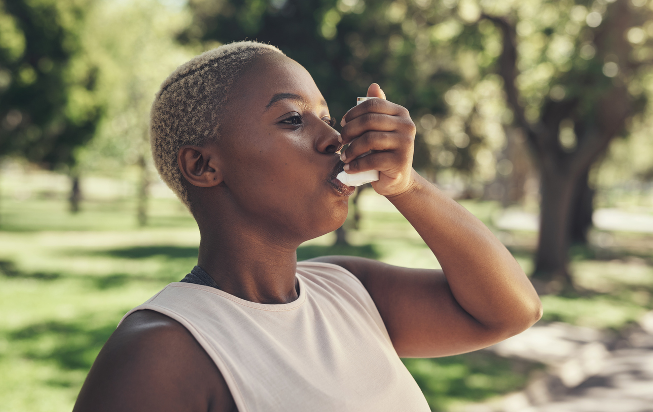 Woman using inhaler