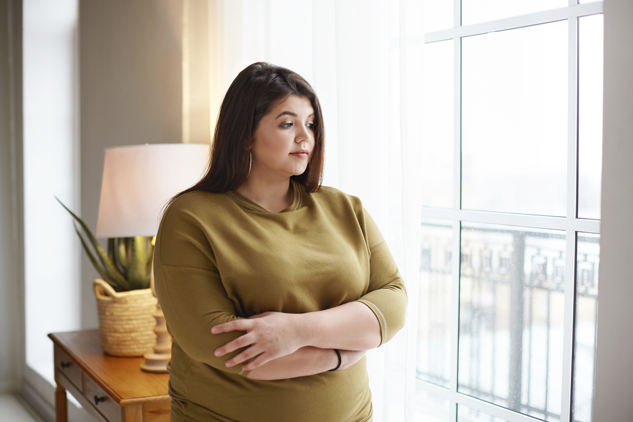 Woman with overweight thinking