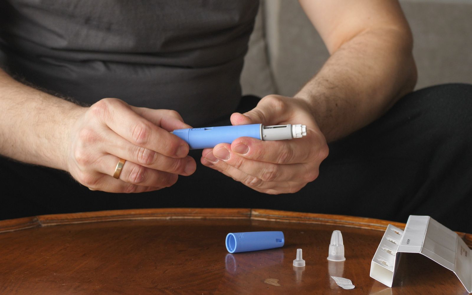 Man preparing injection medication