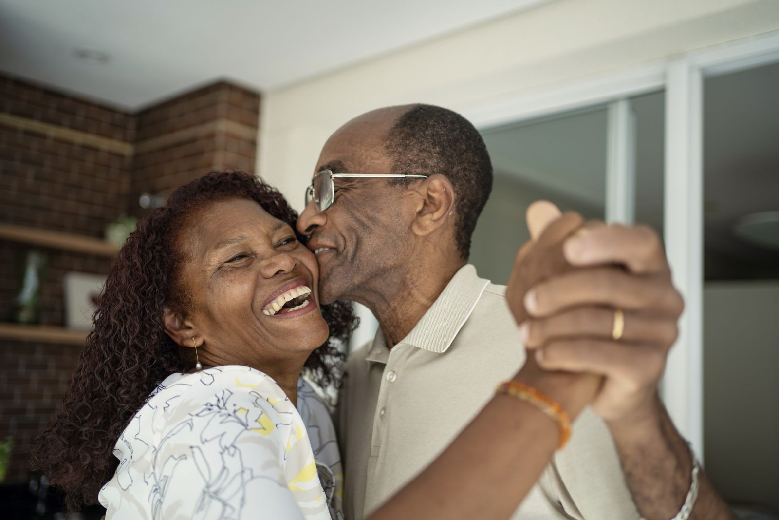 older married couple laughing and dancing