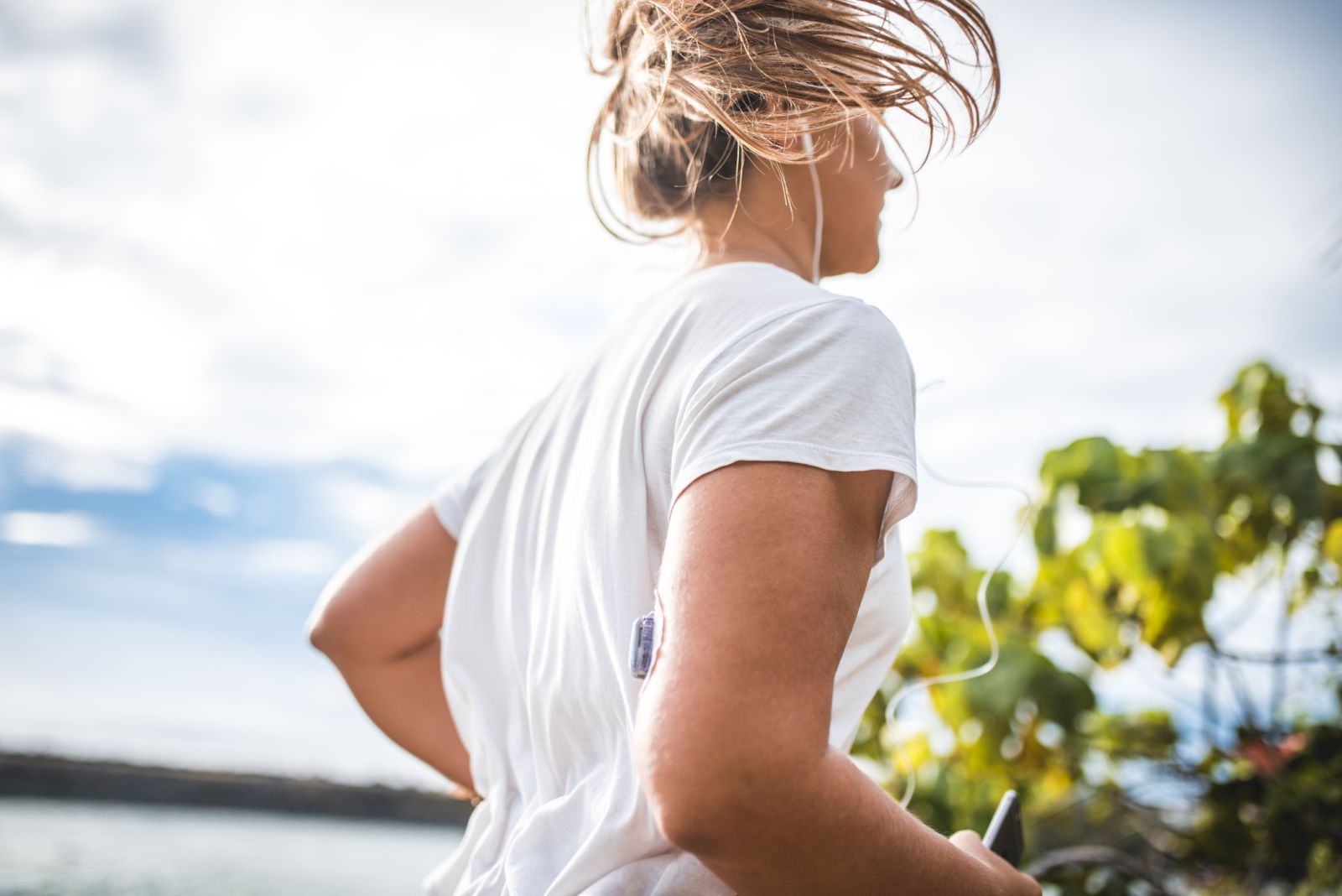 A person with diabetes exercises while wearing a CGM