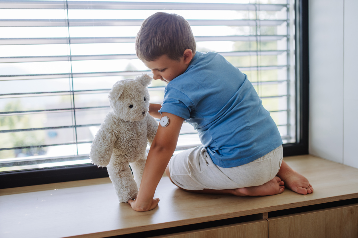 A boy uses CGM to manage his blood sugar