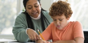 A student receives individualized help at school 