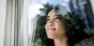 Woman looking out window