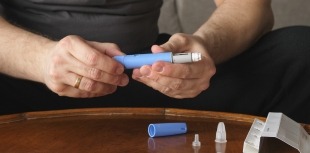 Man preparing injection medication