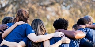 support group huddles together