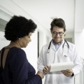 A woman consults her healthcare provider about participating in a clinical trial