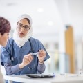 Doctor explaining insulin pen to patient