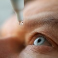 Man putting in eyedrops