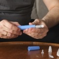 Man preparing injection medication