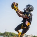 Football player catching ball